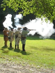 revolutionary war actors firing muskets